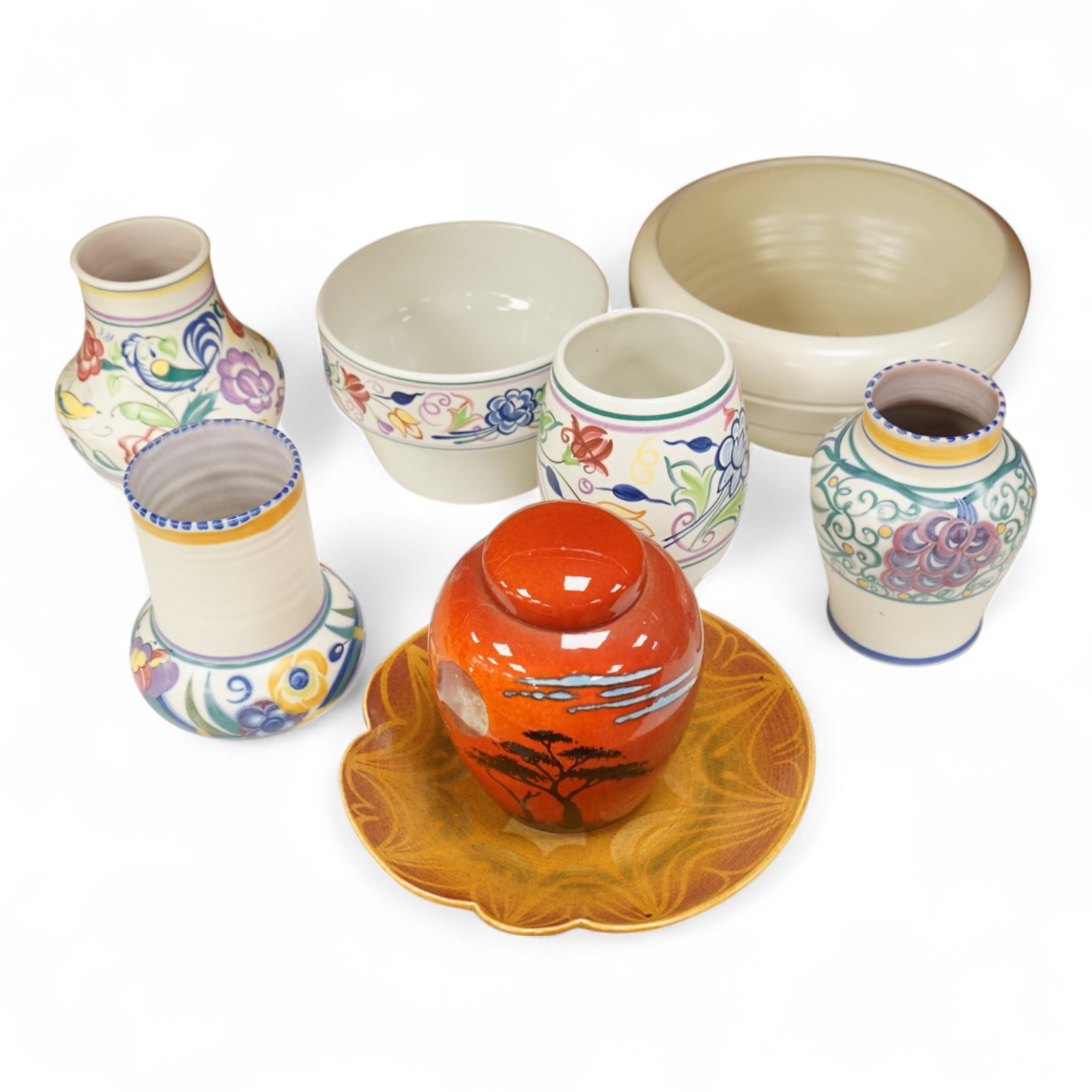 A collection of eight Poole pottery pieces to include vases, bowls and a jar and cover, largest 28cm in diameter